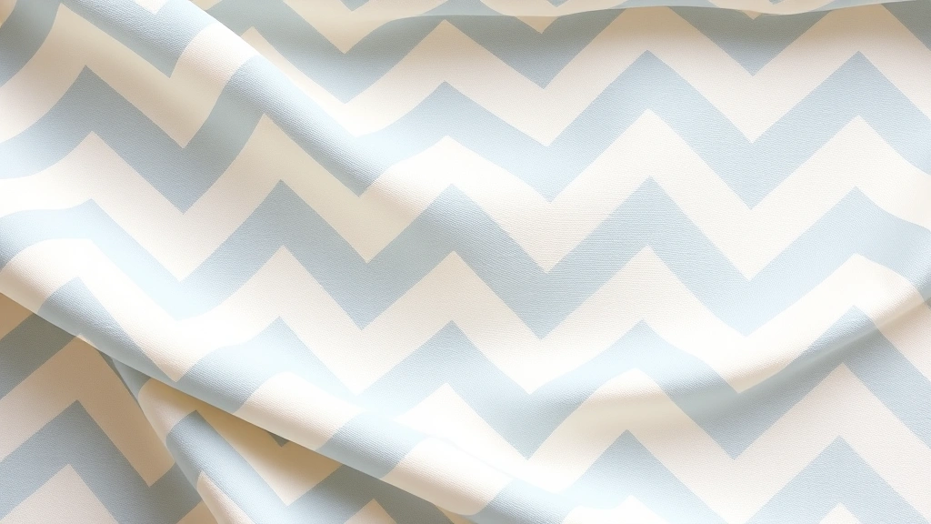 Close-up of completed chevron ripple pattern in cream and dusty blue stripes, soft lighting, fabric draped naturally showing wave structure, no text visible
